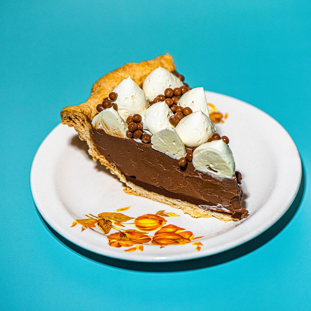 Peaches Patisserie Chocolate pie product displayed on a bright light blue background.