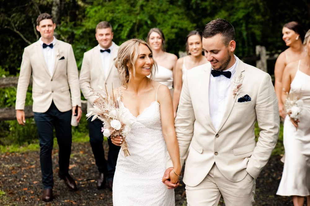 Group wedding photo taken outdoors at Bellingen Riverside Cottages by Lou Walpole Dorrigo Wedding Photographer