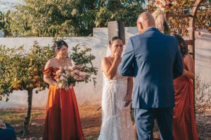 Bride crying happy tears at alter, backyard wedding in San Diego CA