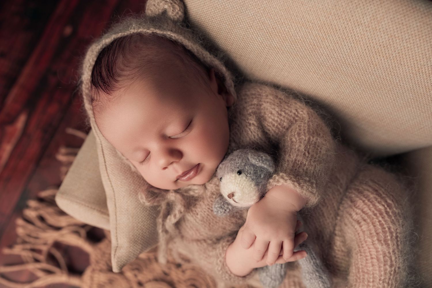 Newborn Photographer Cape Town baby holding a bear cuddly By Grace Photography