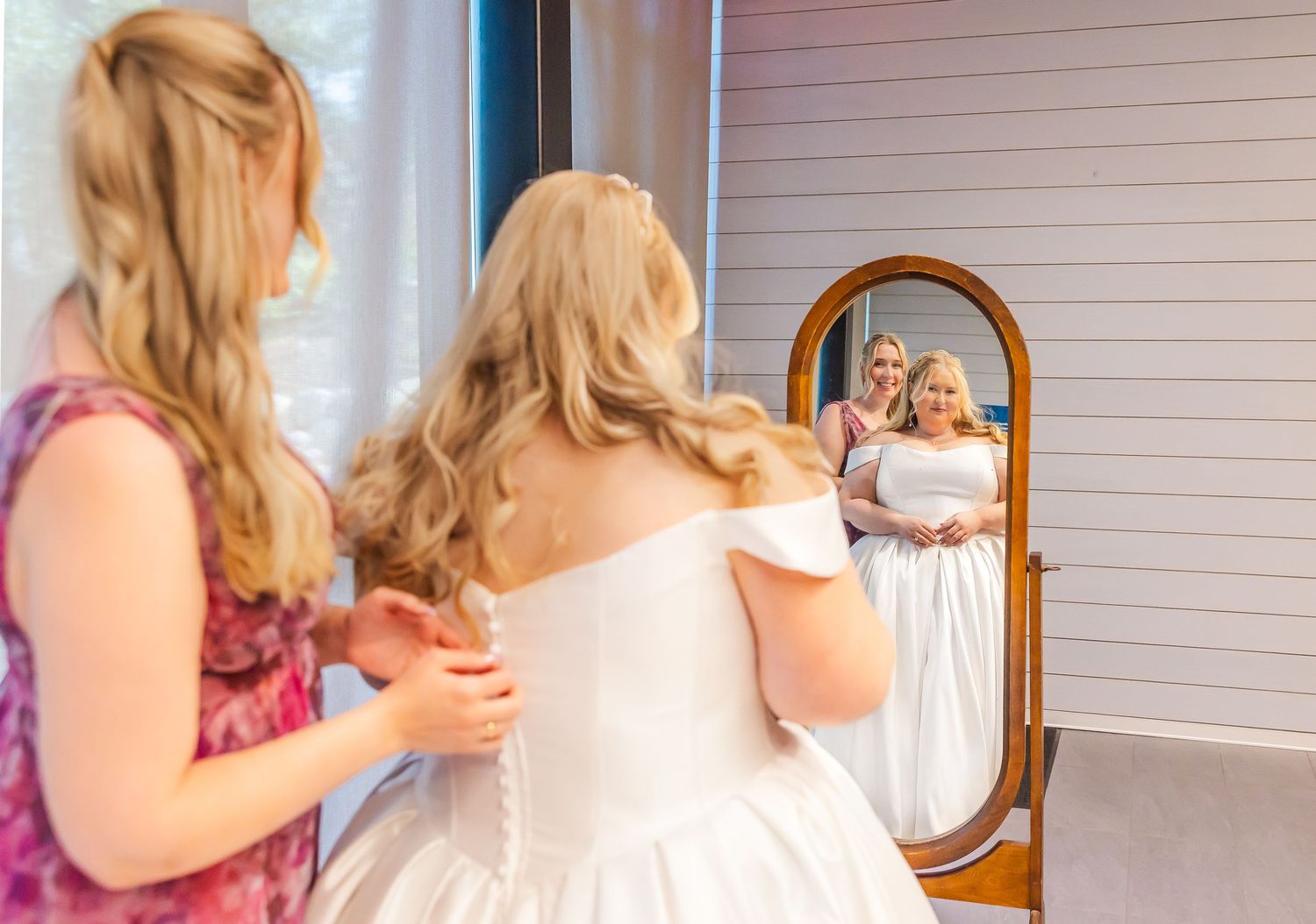 A series of images showing someone with blonde hair looking in a mirror while getting ready.
