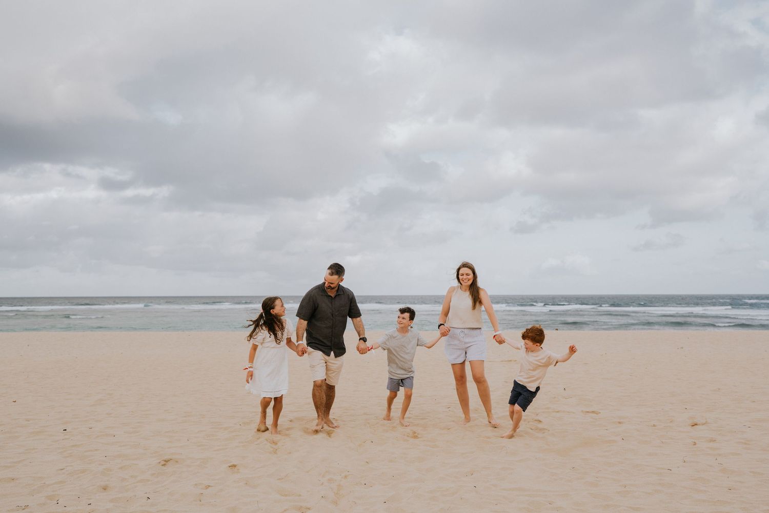 Beach family photography in Bali with an
ocean backdrop