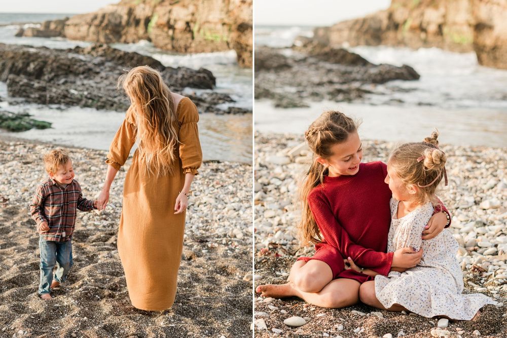 sisters sitting and hugging on the beach for a family photo session. mom holding hands with youngest and walking on the beach