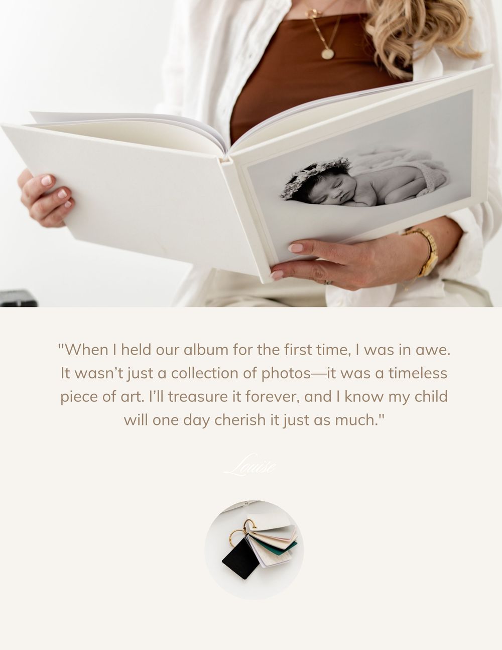 A person holds and reads a white photo album or book while sitting on a couch.