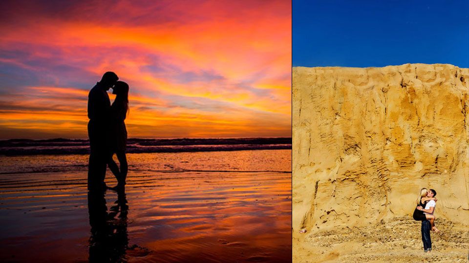 Panoramic view of orange sandstone cliffs reflecting in calm blue water with white birds floating at sunset.