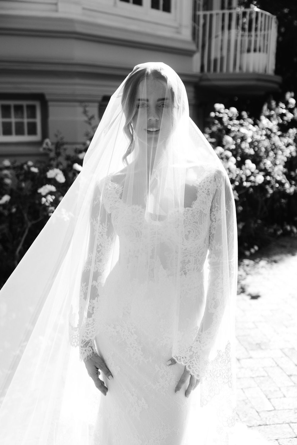 Ethereal black and white photo sequence of a bride in flowing veil outdoors in sunlight.