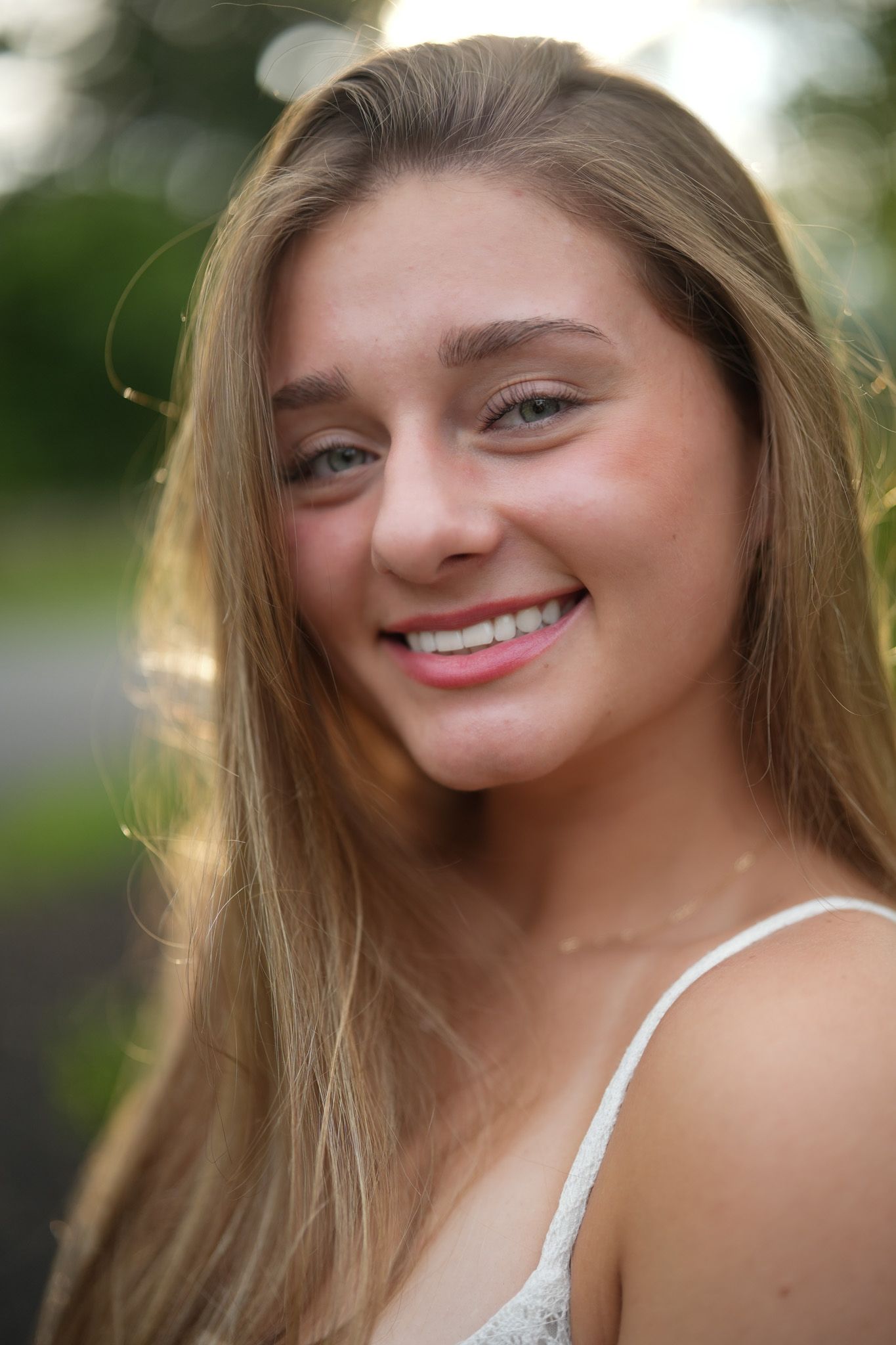 Portrait in soft natural lighting with bokeh background.
