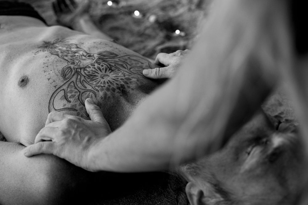 Artistic black and white capture of massage therapy session.