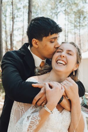 A series of intimate wedding photos showing candid laughing moments between a couple in formal attire outdoors.