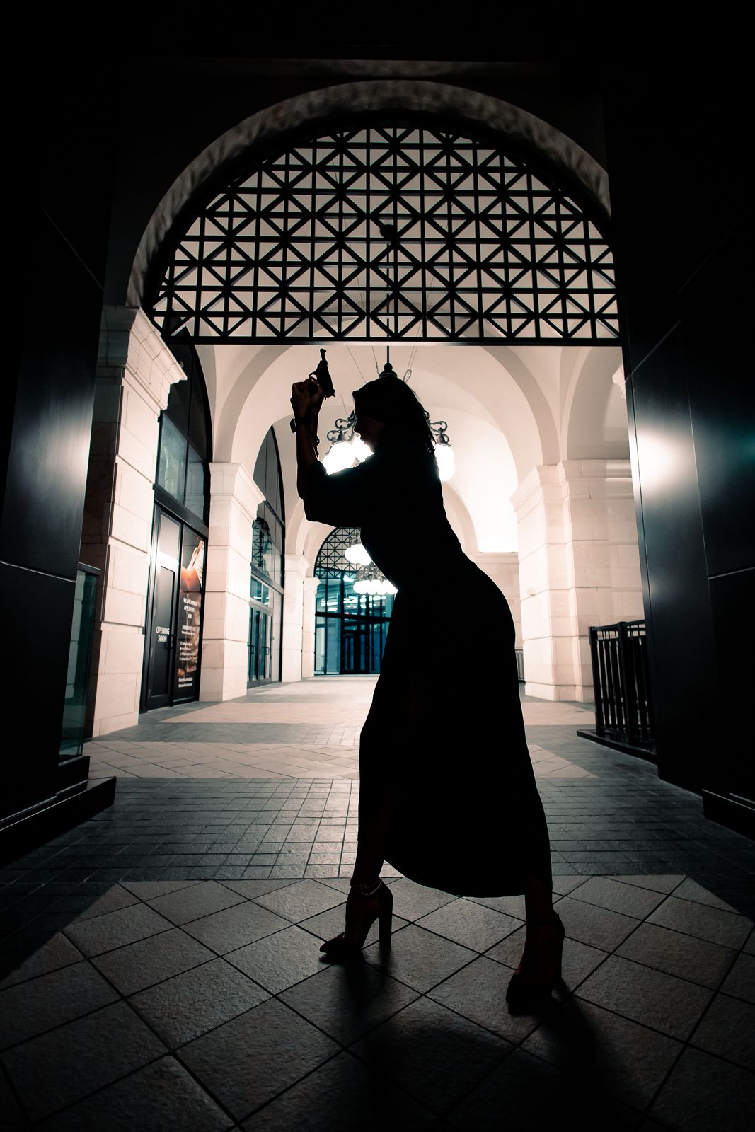 Dramatic South Florida silhouette portrait under arches, cinematic editorial lighting perfect for film students and actors. MannyPortraits.