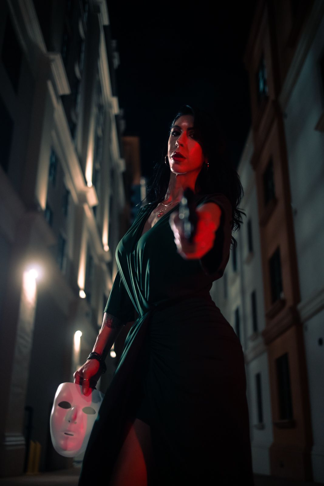 Cinematic dark editorial in Miami, costumed performer with Gotham-inspired styling, dramatic portrait photography by MannyPortraits
