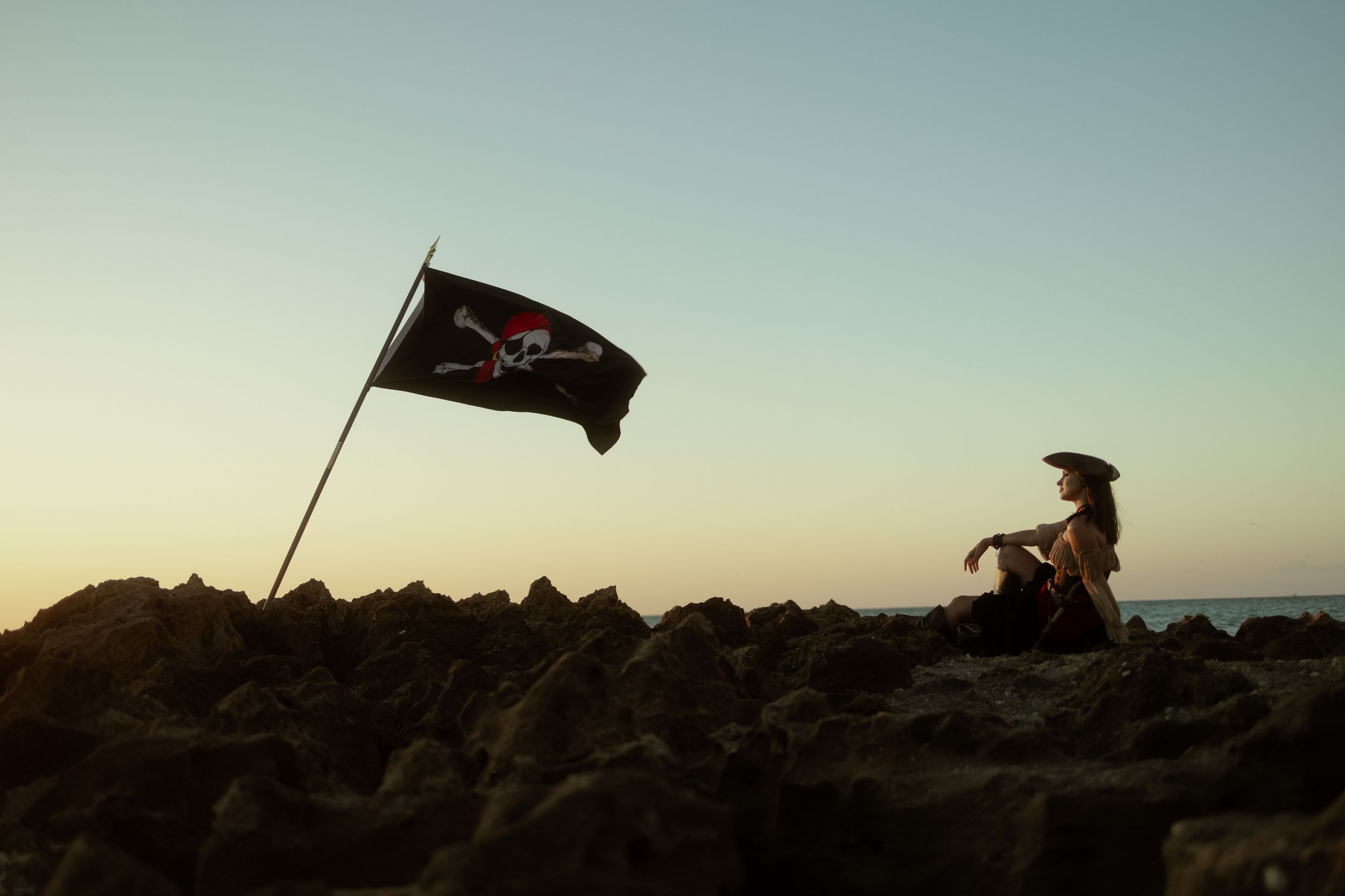 Pirate flag at sunset, cinematic South Florida beach editorial by Mannyportraits, Pirates of the Caribbean vibes for actors & creatives.