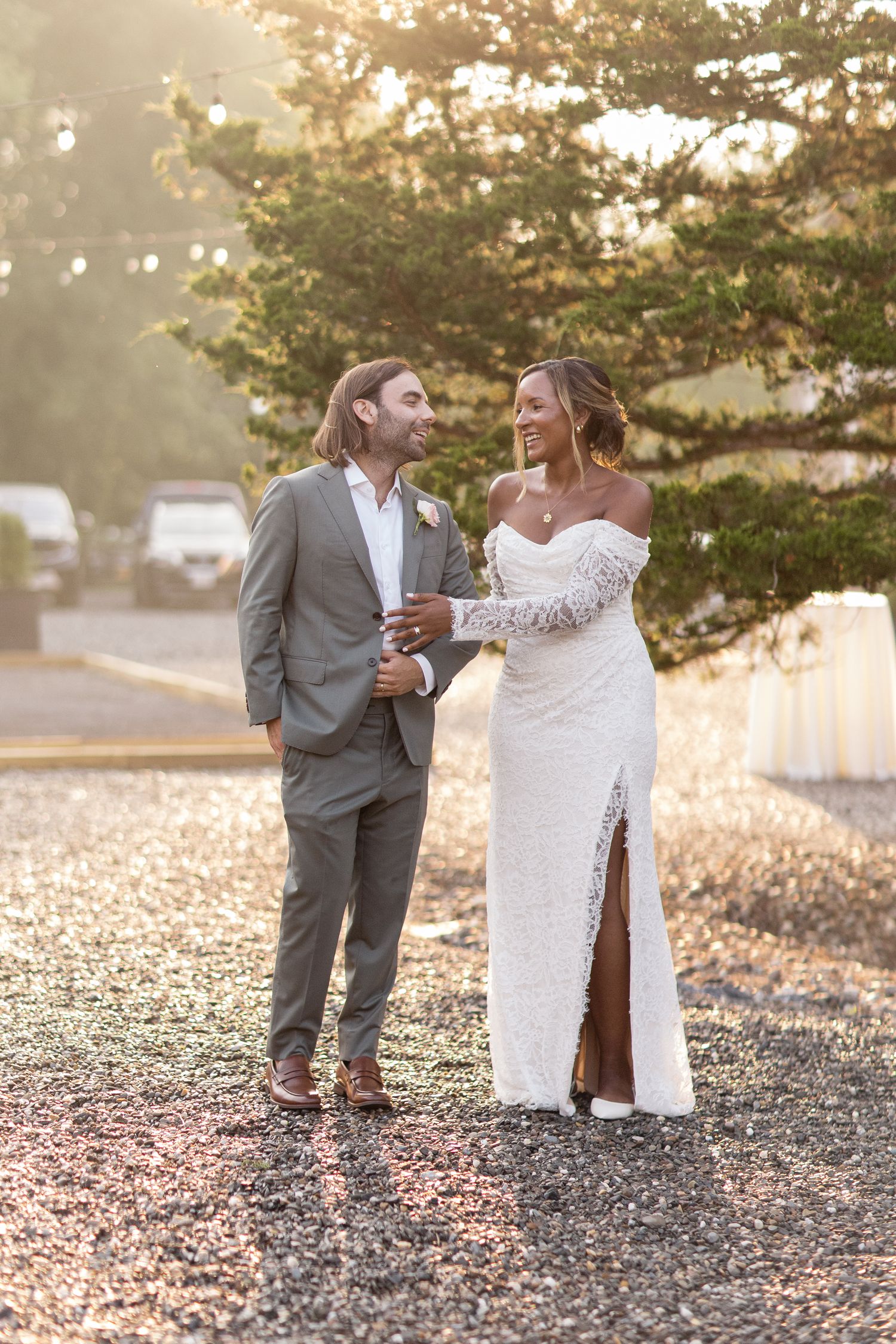 An intimate wedding photoshoot sequence on gravel path at sunset with soft golden lighting.