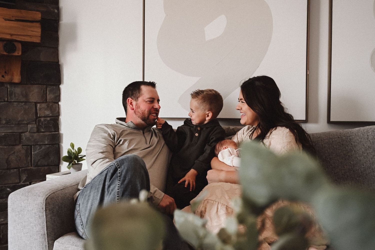 Intimate lifestyle photography of family gathering in cozy home setting.