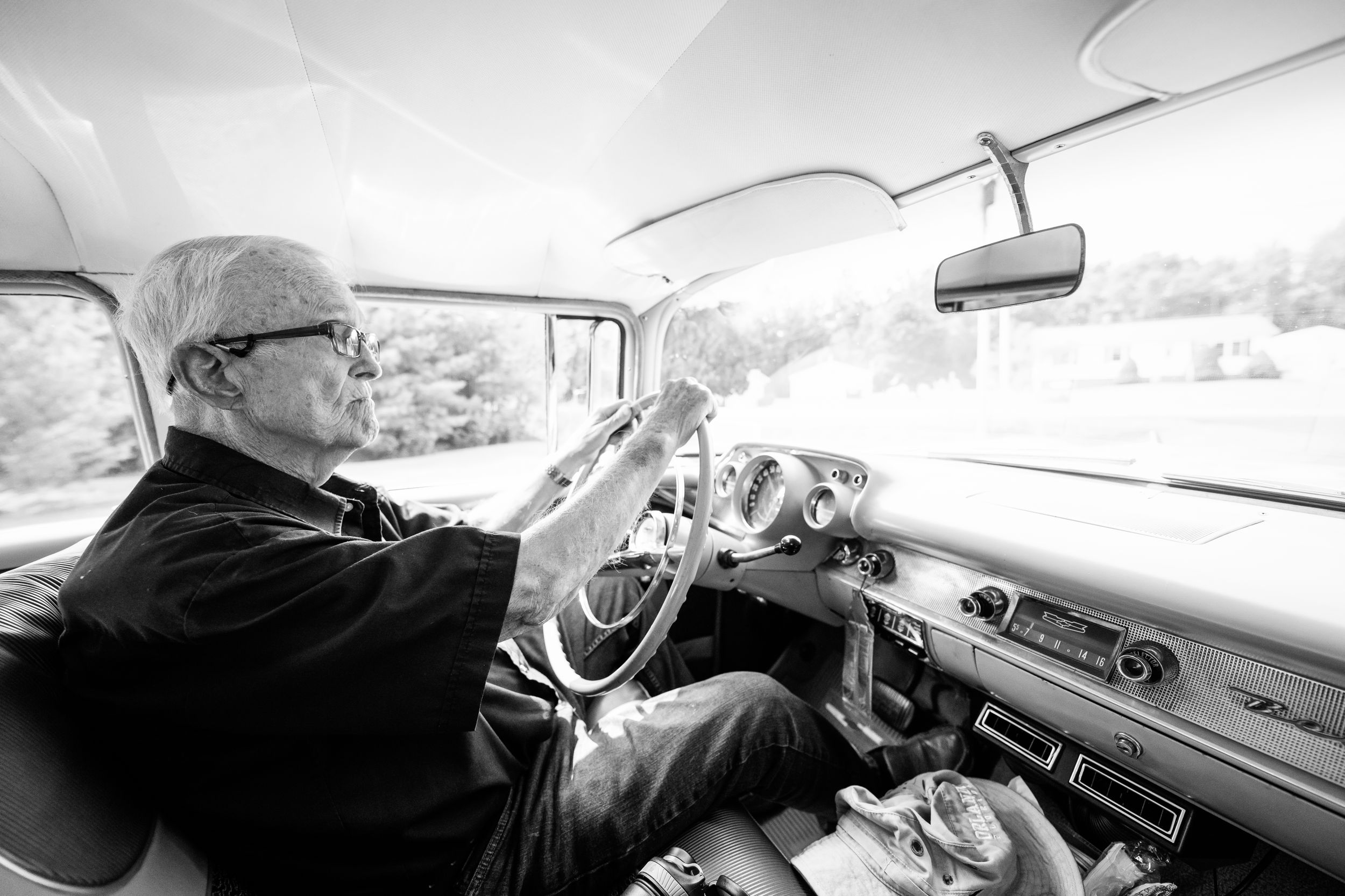 Black and white images of car interior views while driving.