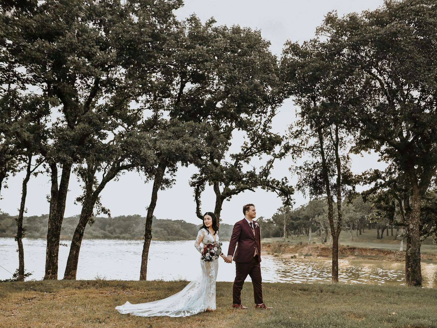 Bride and groom holding hands outside Bentley Station in Lake Dallas