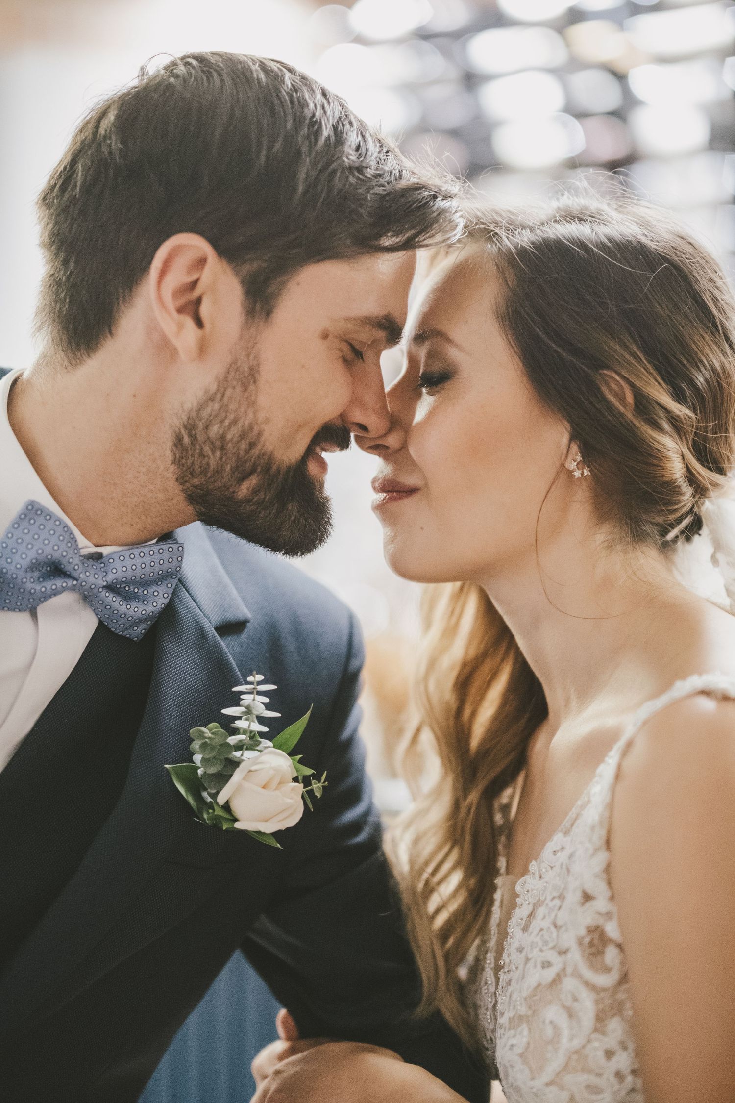 A romantic collection of wedding portraits showing tender moments and soft embraces between newlyweds.