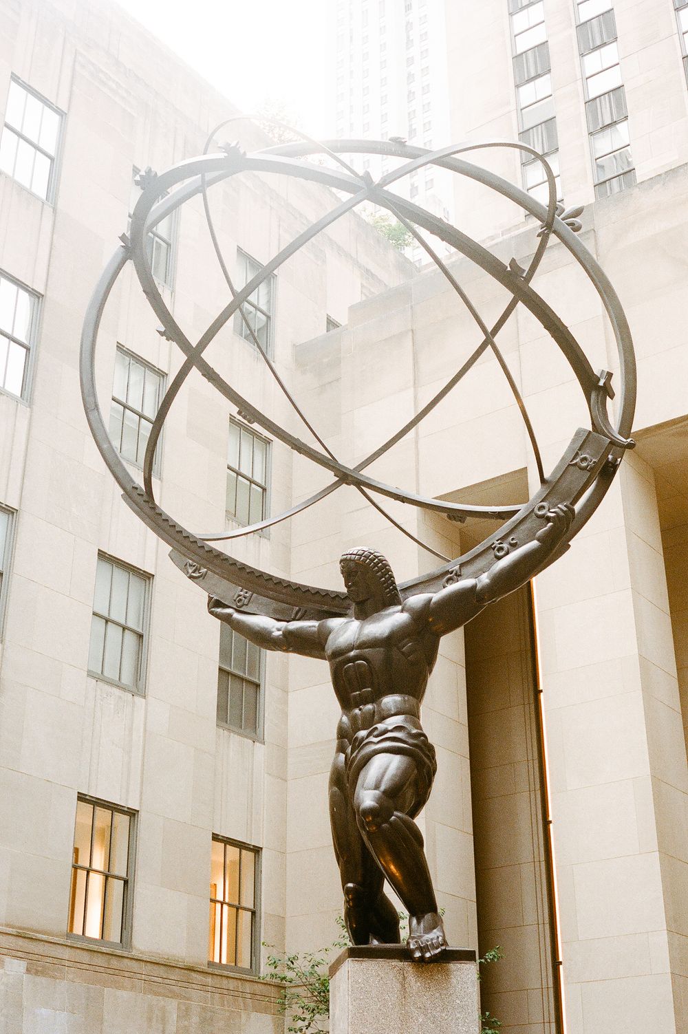 Bronze Atlas statue holds up a celestial sphere at Rockefeller Center in New York City.