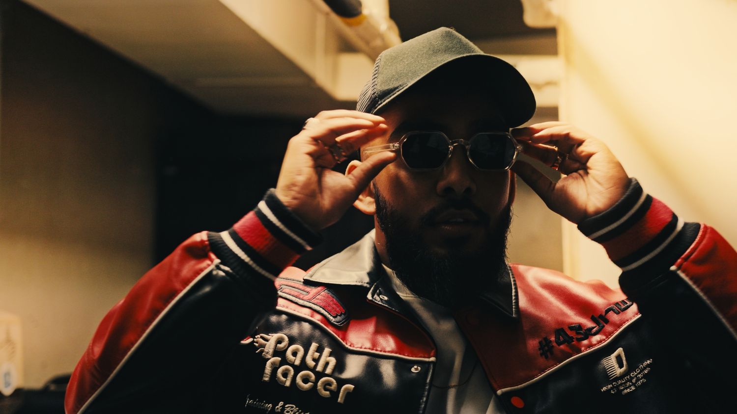 Photograph of a performer trying on glasses
