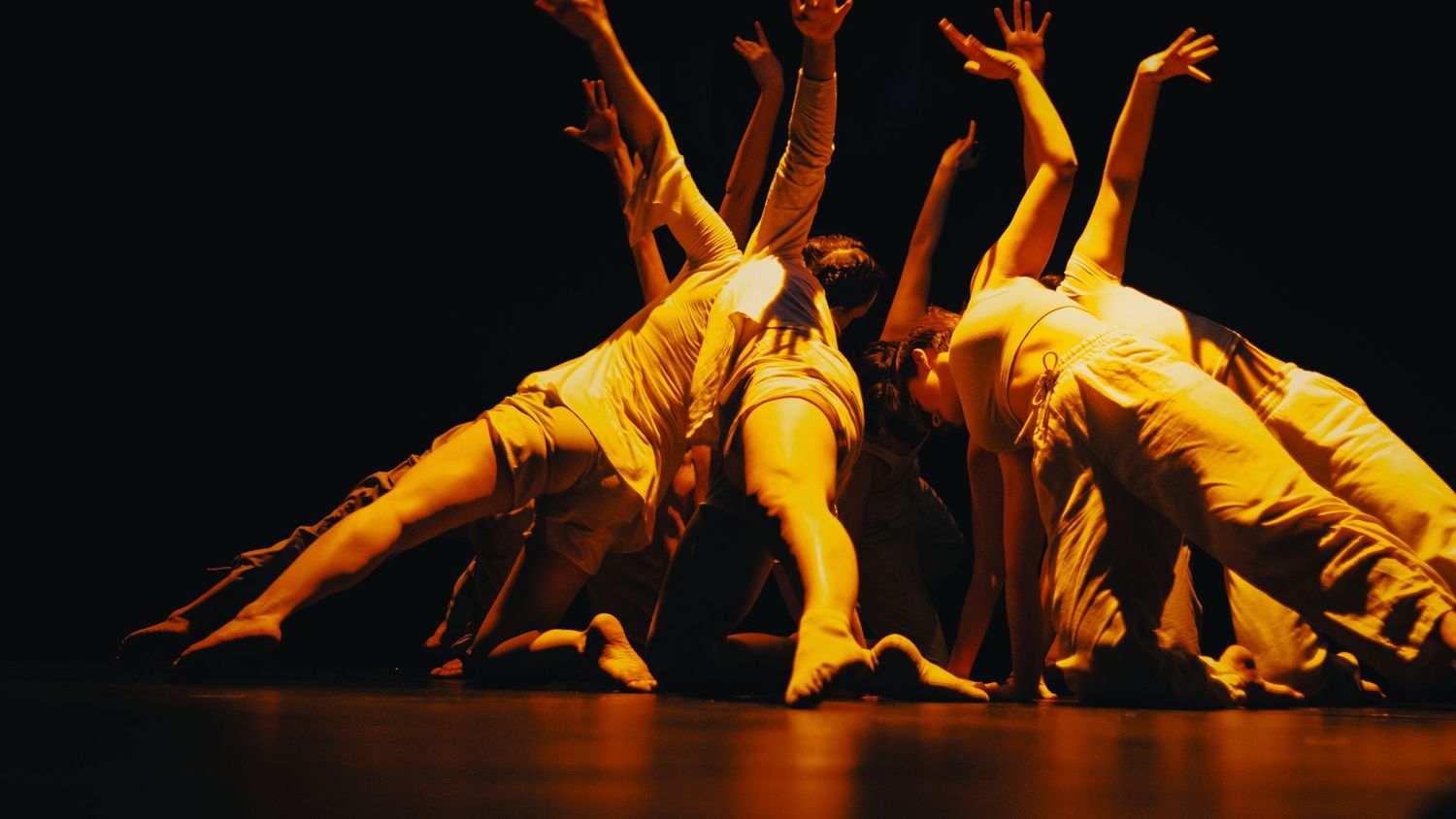 Photograph of dancers extending their limbs