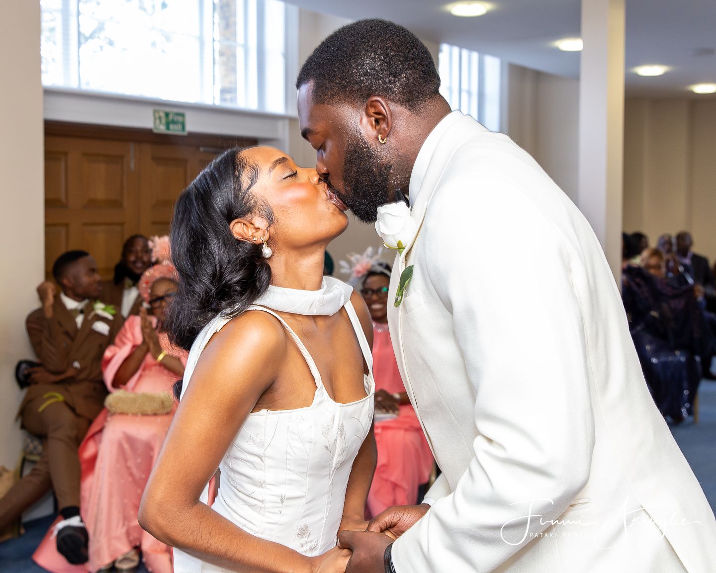 A bride and groom sharing their first kiss
