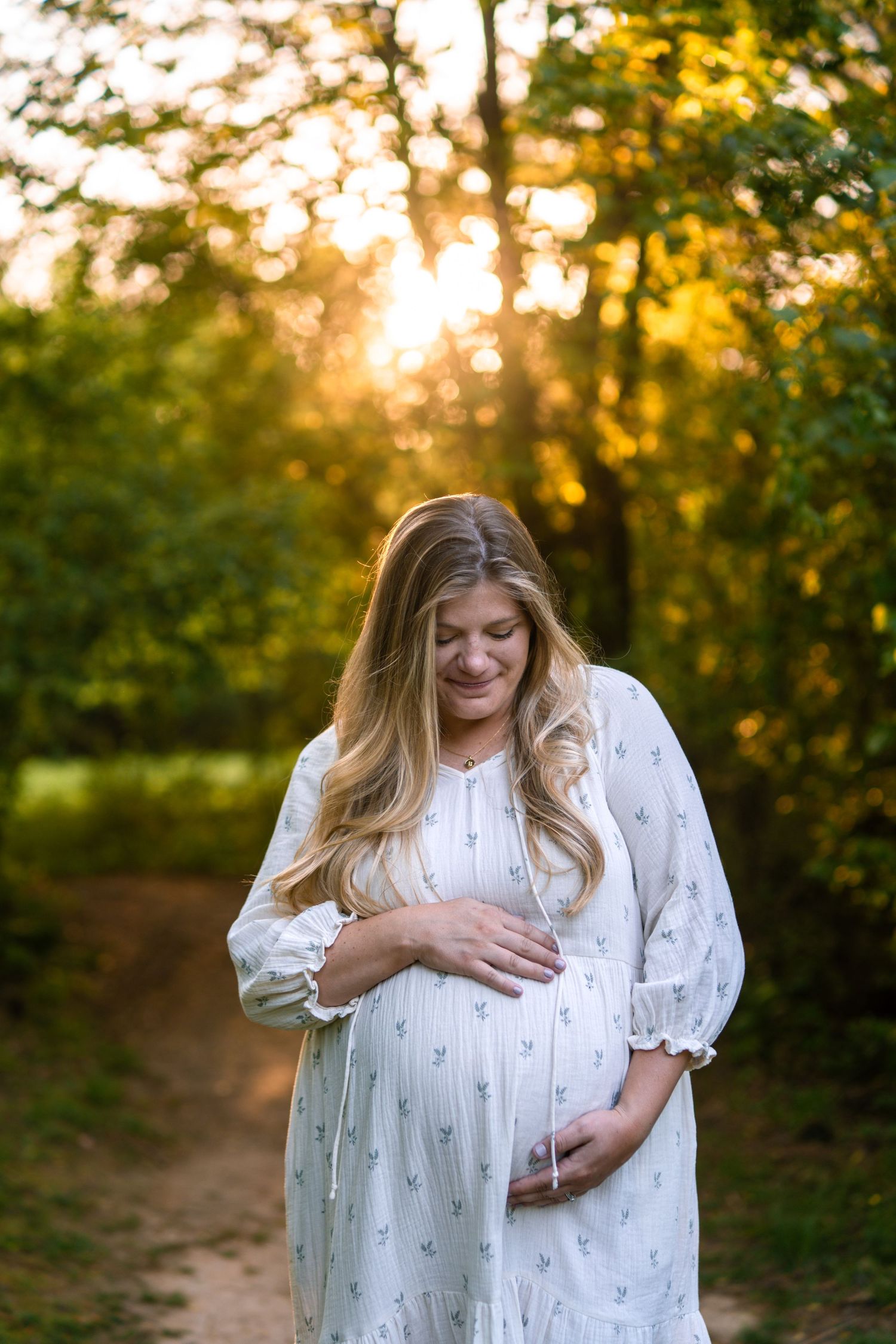 Pregnant wife with husband at a Marietta park maternity session