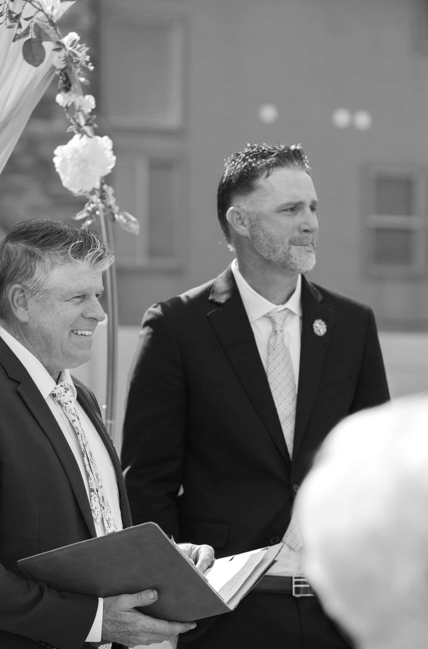 Groom looking at his bride coming doing the aisle at intimate backyard wedding in west haven utah