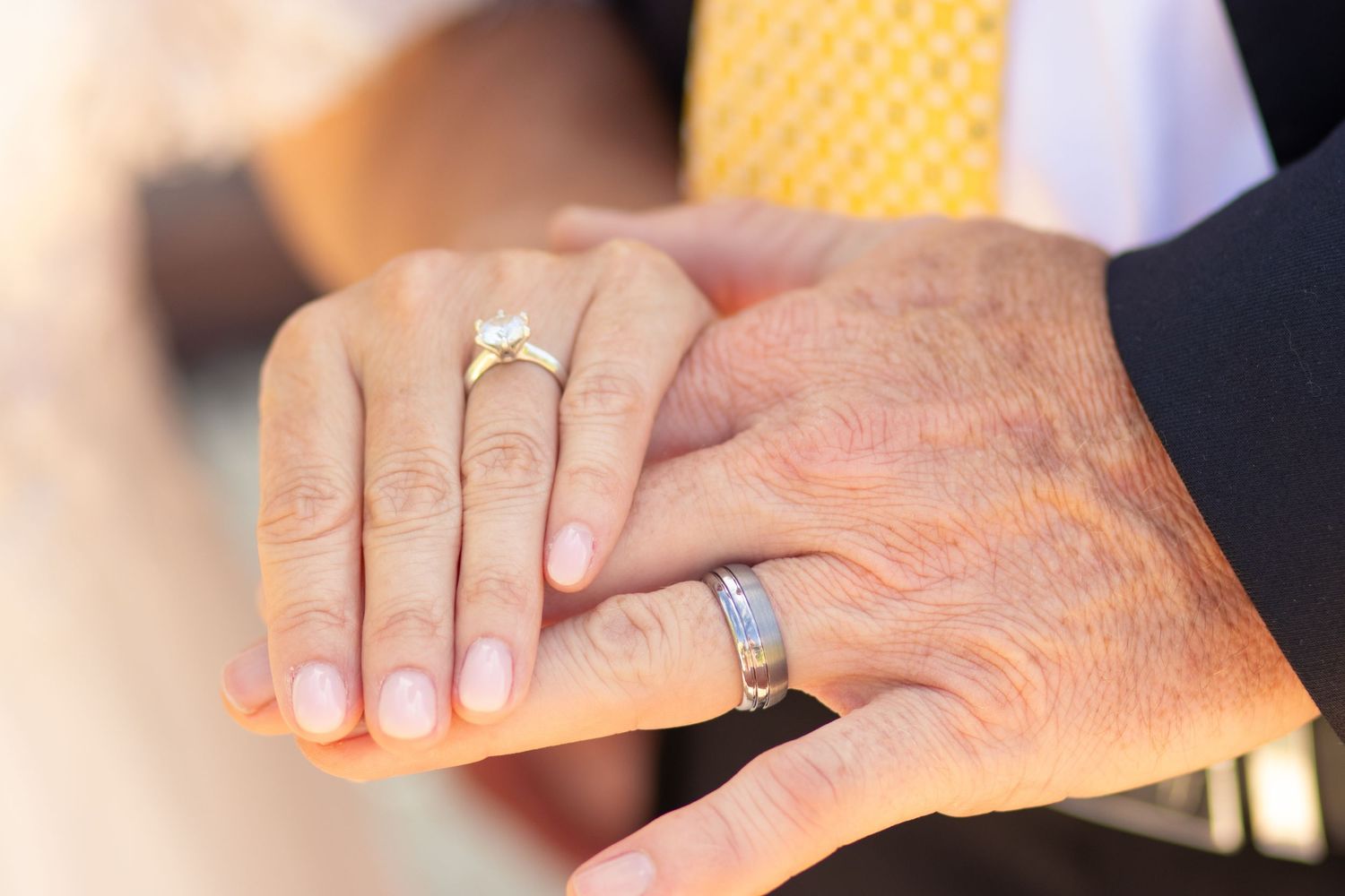 Detail shot of rings in backyard wedding