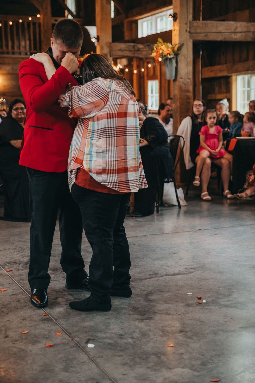 Two people dance together in a rustic barn venue. Midwest photographer vigo parke Clay County terre haute