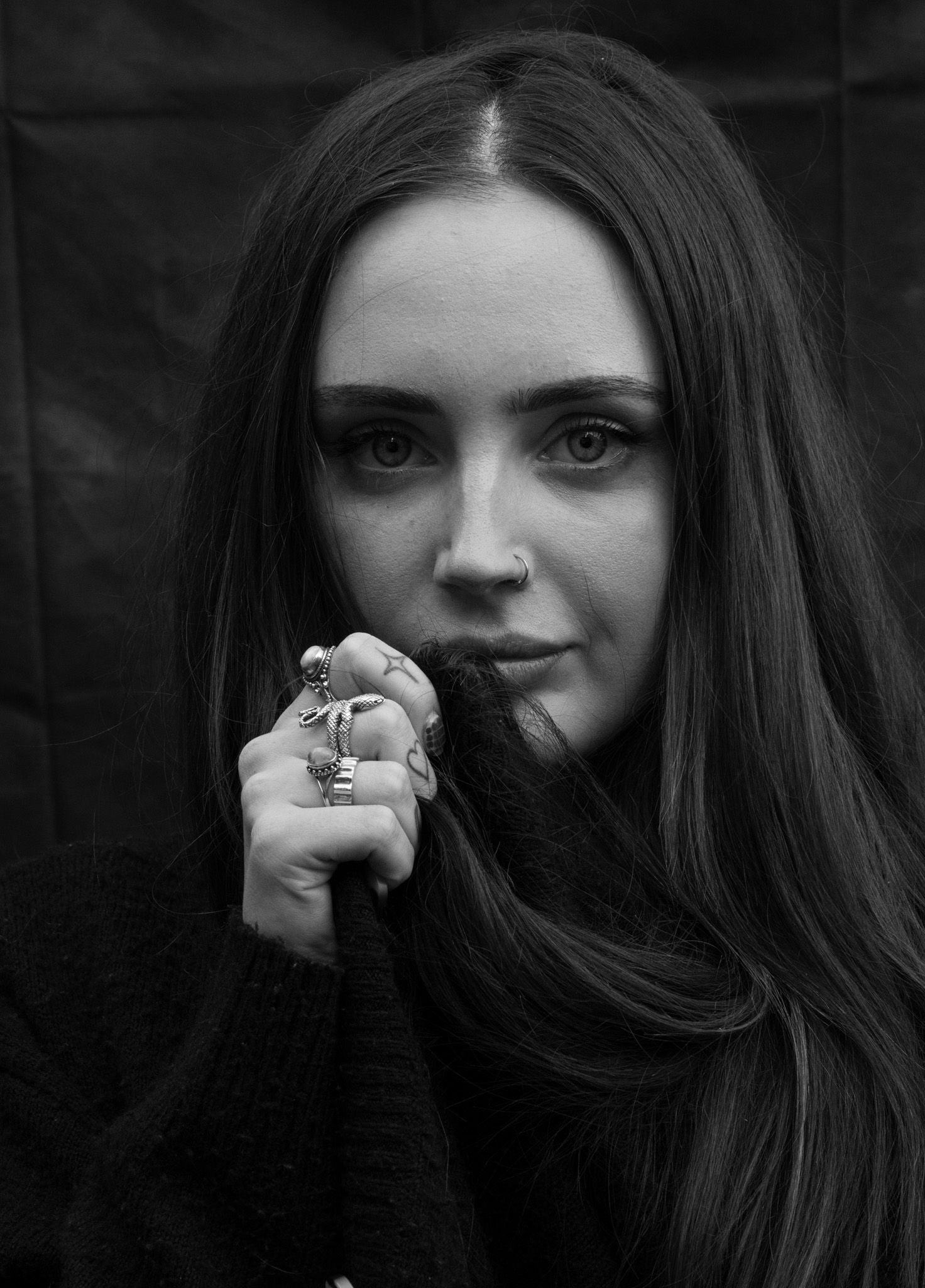 Stunning portrait photograph of a young woman looking directly into camera. Taken by Isobel Hughes Photography in Haworth West Yorkshire.