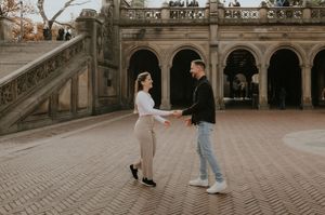 A couple dances together on the stone plaza near Bethesda Terrace in Central Park.