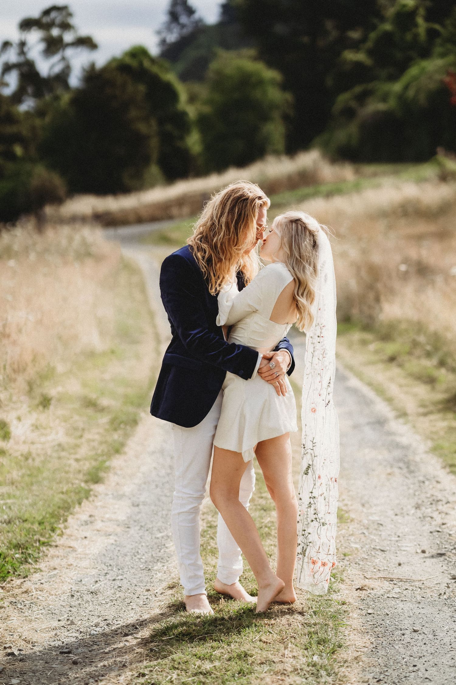 Wedding couple on driveway, country wedding photos, blue velvet groom, wedding photography Nelson, wedding photographer Nelson