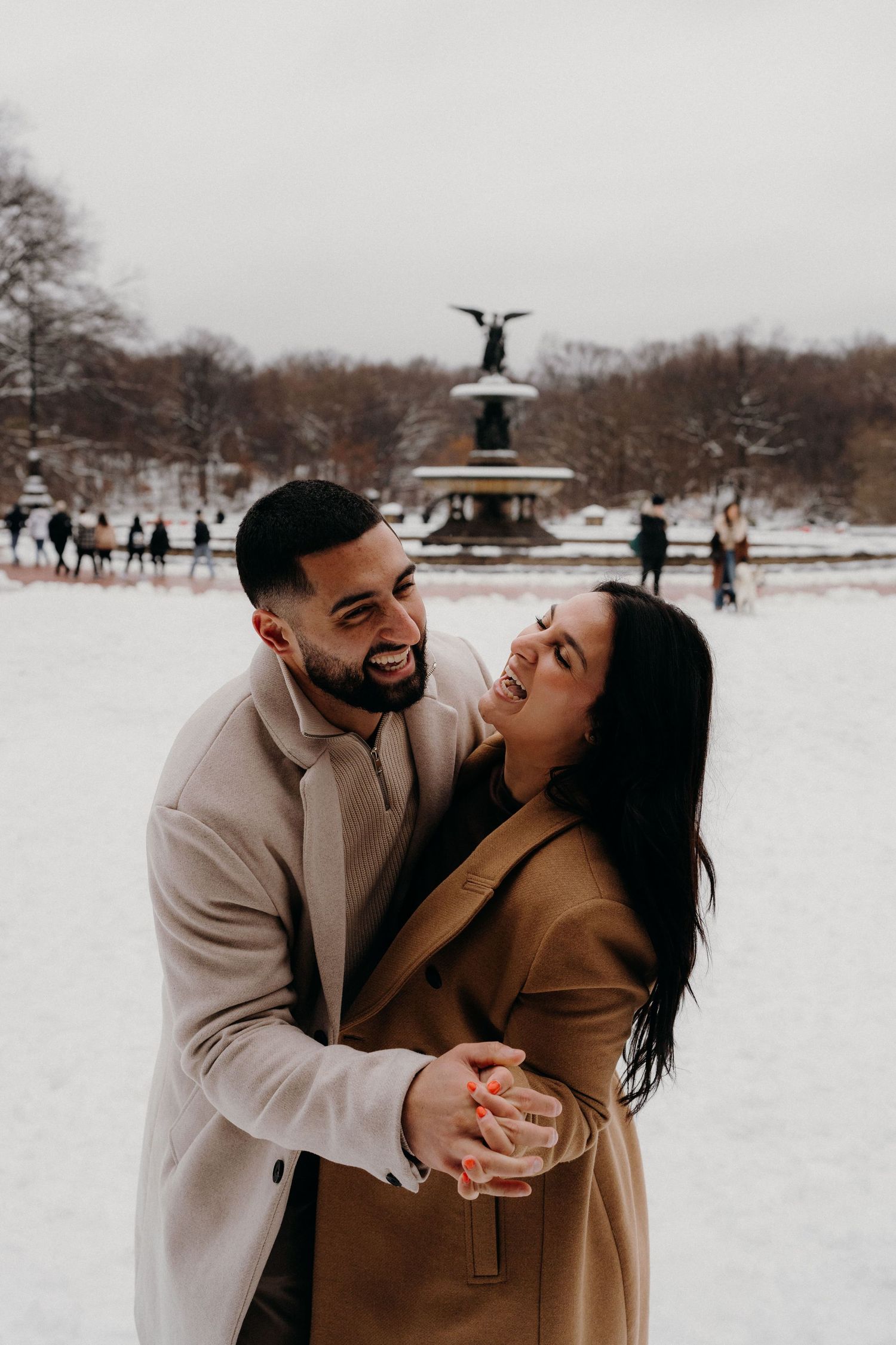 A winter engagement photoshoot in front of Bethesda Fountain in Central Park, New York.