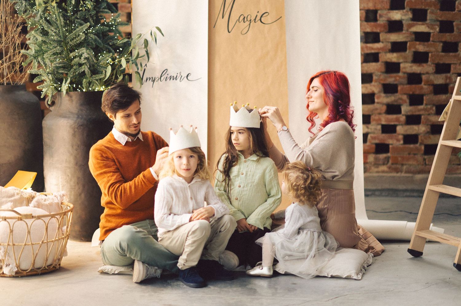 Family shares tender moments together in soft neutral-toned living space with plush furnishings and textural details.