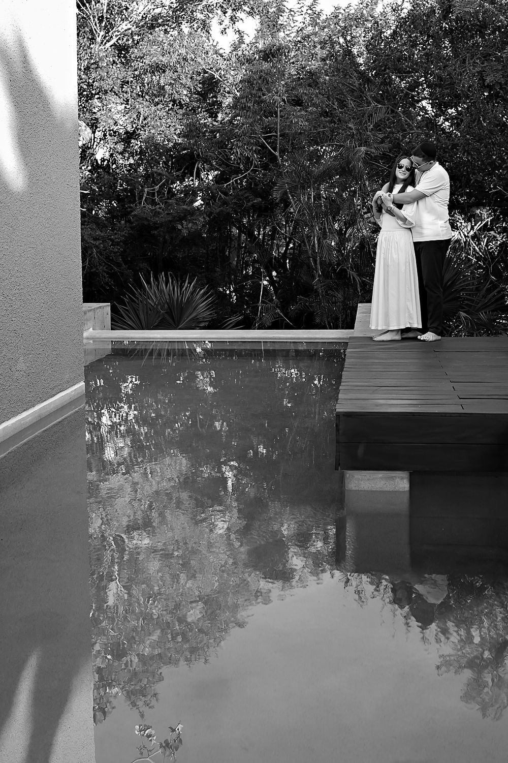 Romantic kiss inside woven nest structure at Banyan Tree Mayakoba.