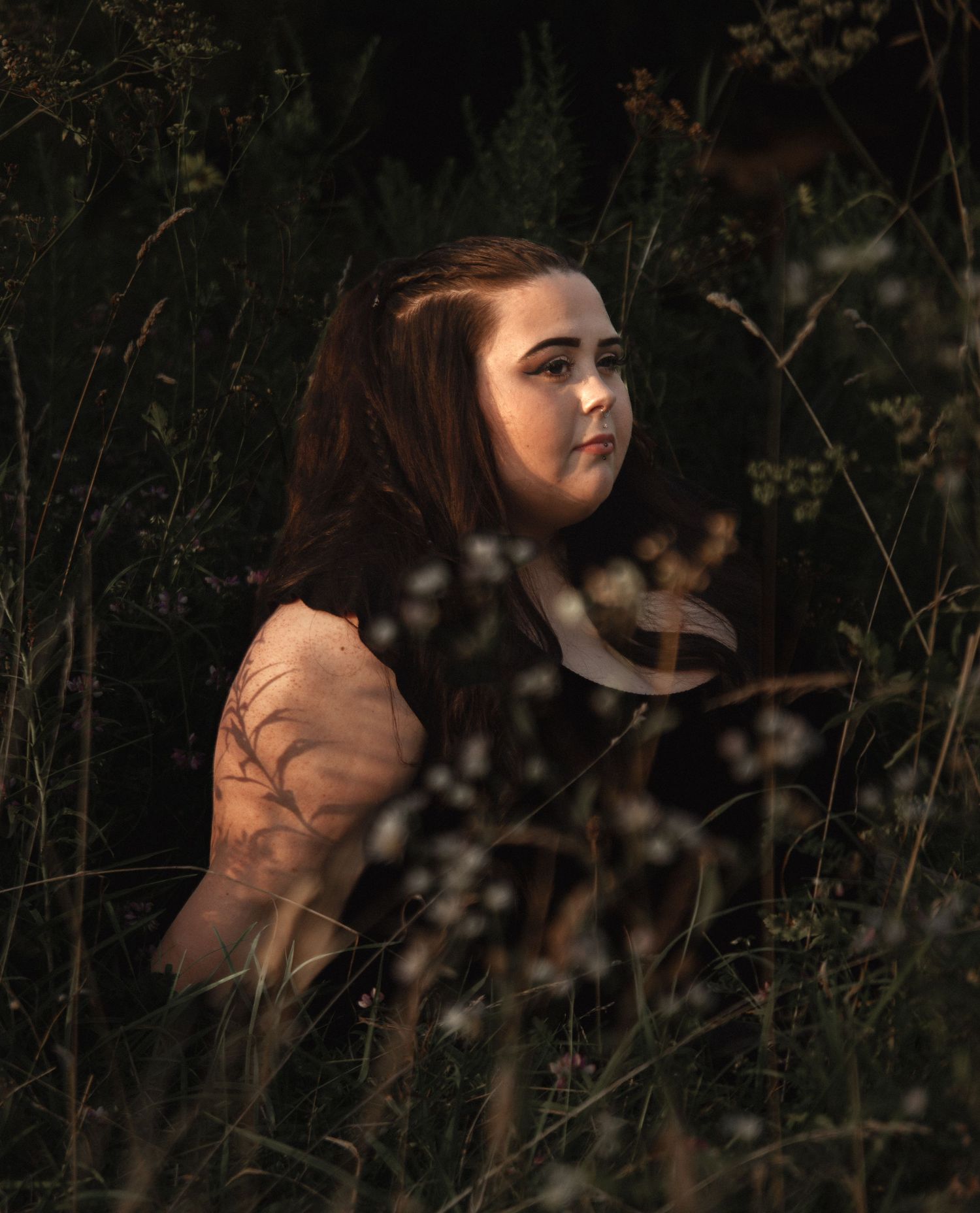 Dreamy portrait sequence captured in a wild garden with soft lighting.