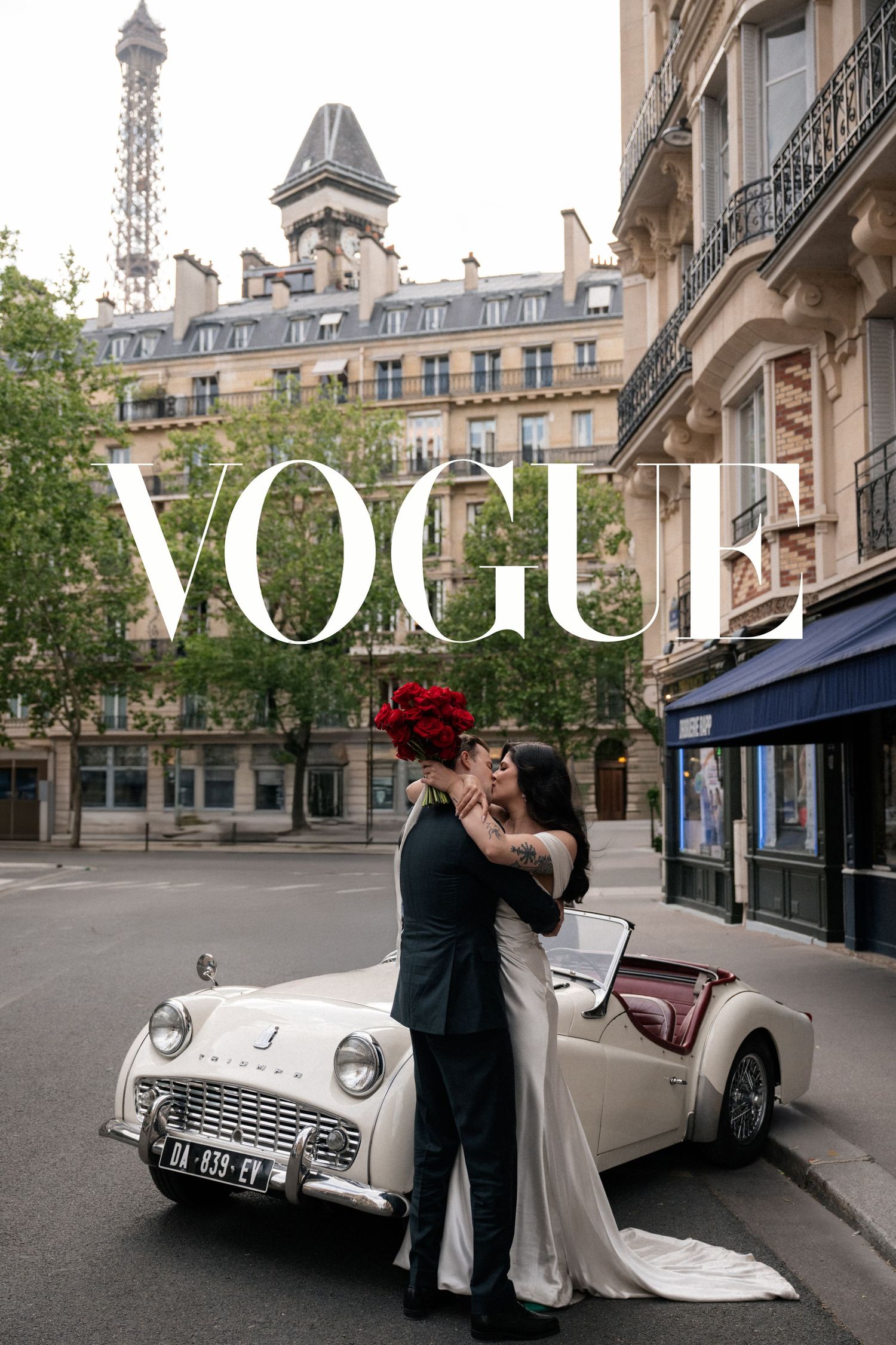 A romantic photoshoot with a vintage car on a classic Parisian street featuring the Eiffel Tower and Vogue magazine branding.