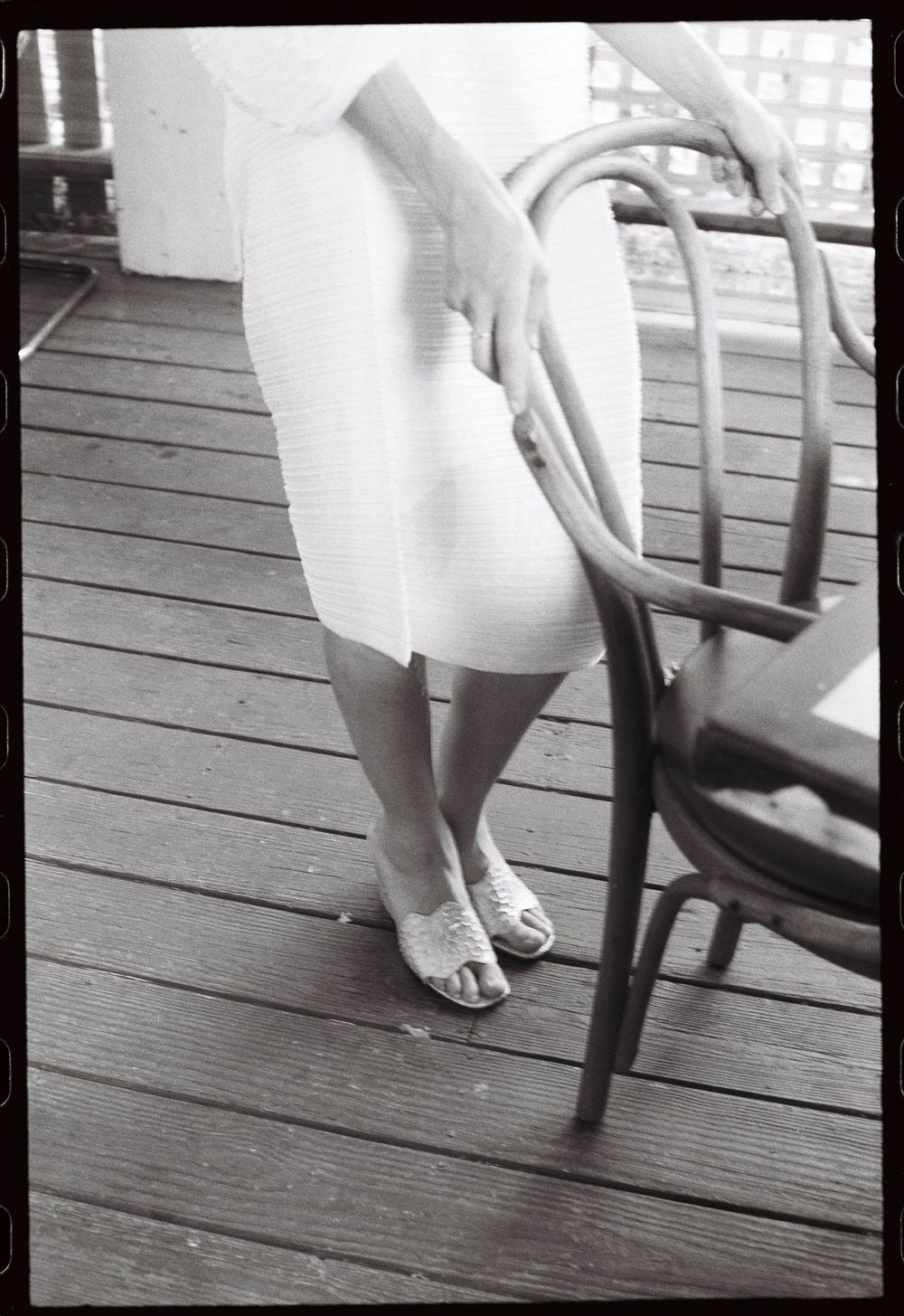 The shoes and the dress, a black and white detail photo of the fiancé and her outfit during an engagement party on film in Brunswick, Maine.