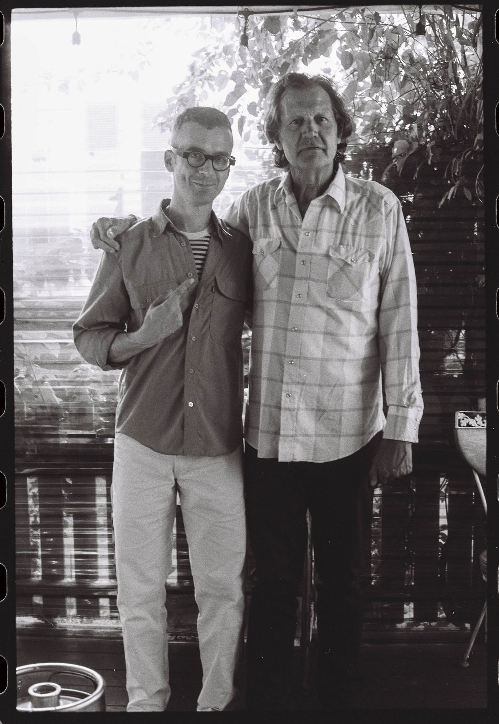 The fiancé poses with his future uncle in law during an engagement party celebration at a wine bar in Brunswick, Maine.