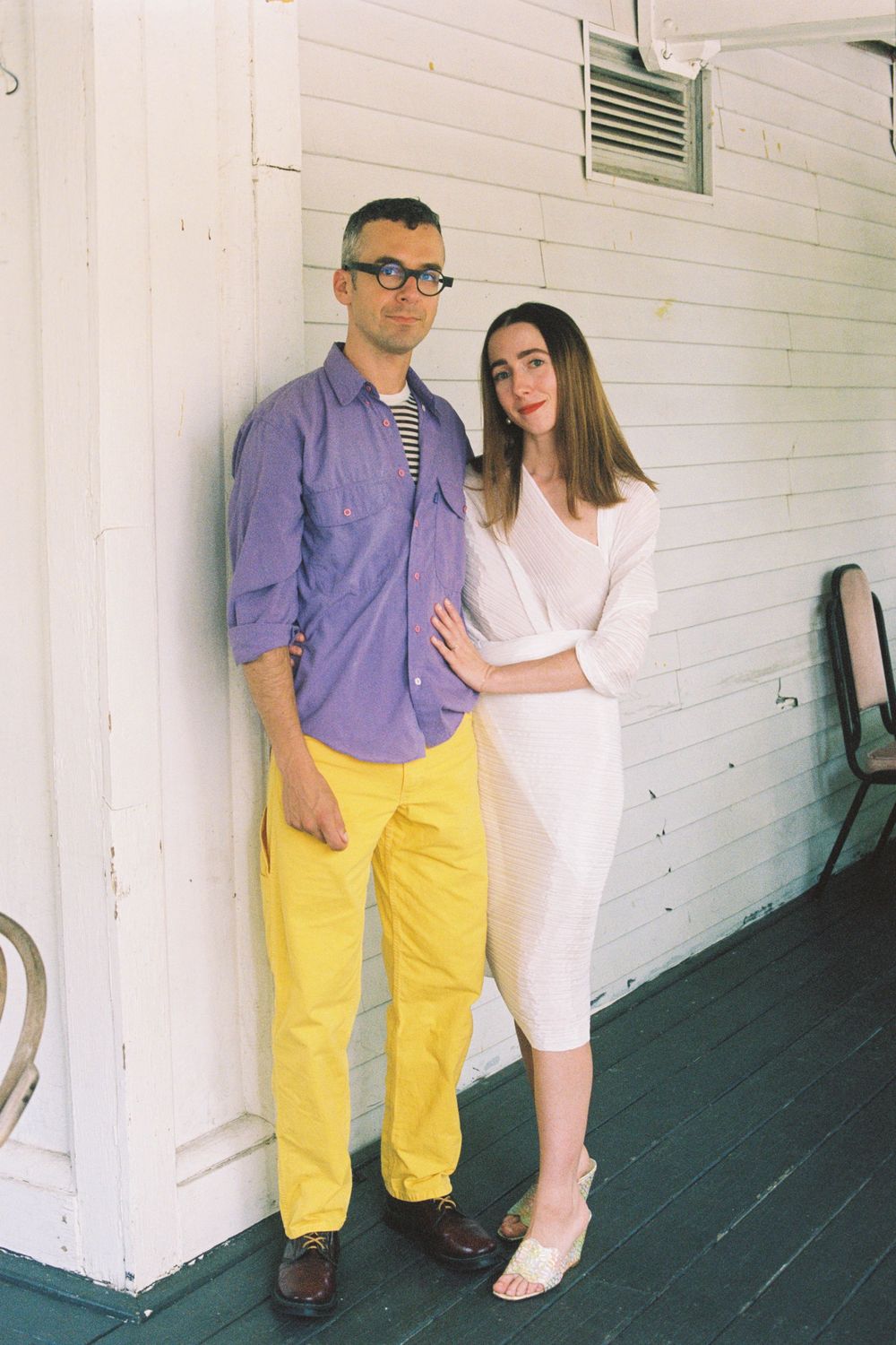 The couple poses together in Issey Miyake Pleats Please dress and colorful clothing, both have very cool style on analog film.