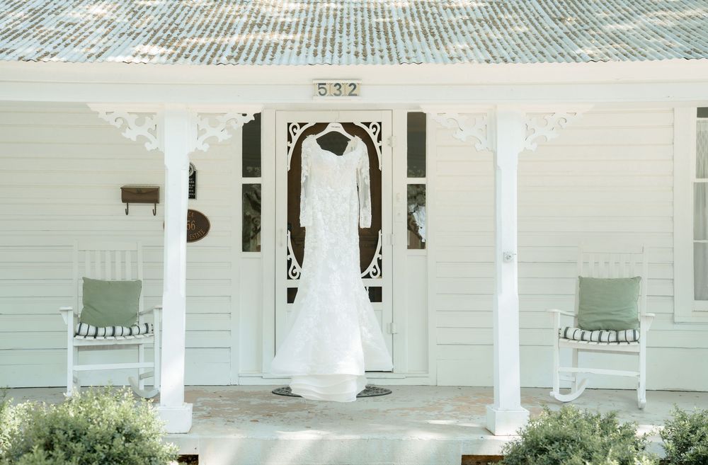 White wedding venue exterior with classic columns and architecture.