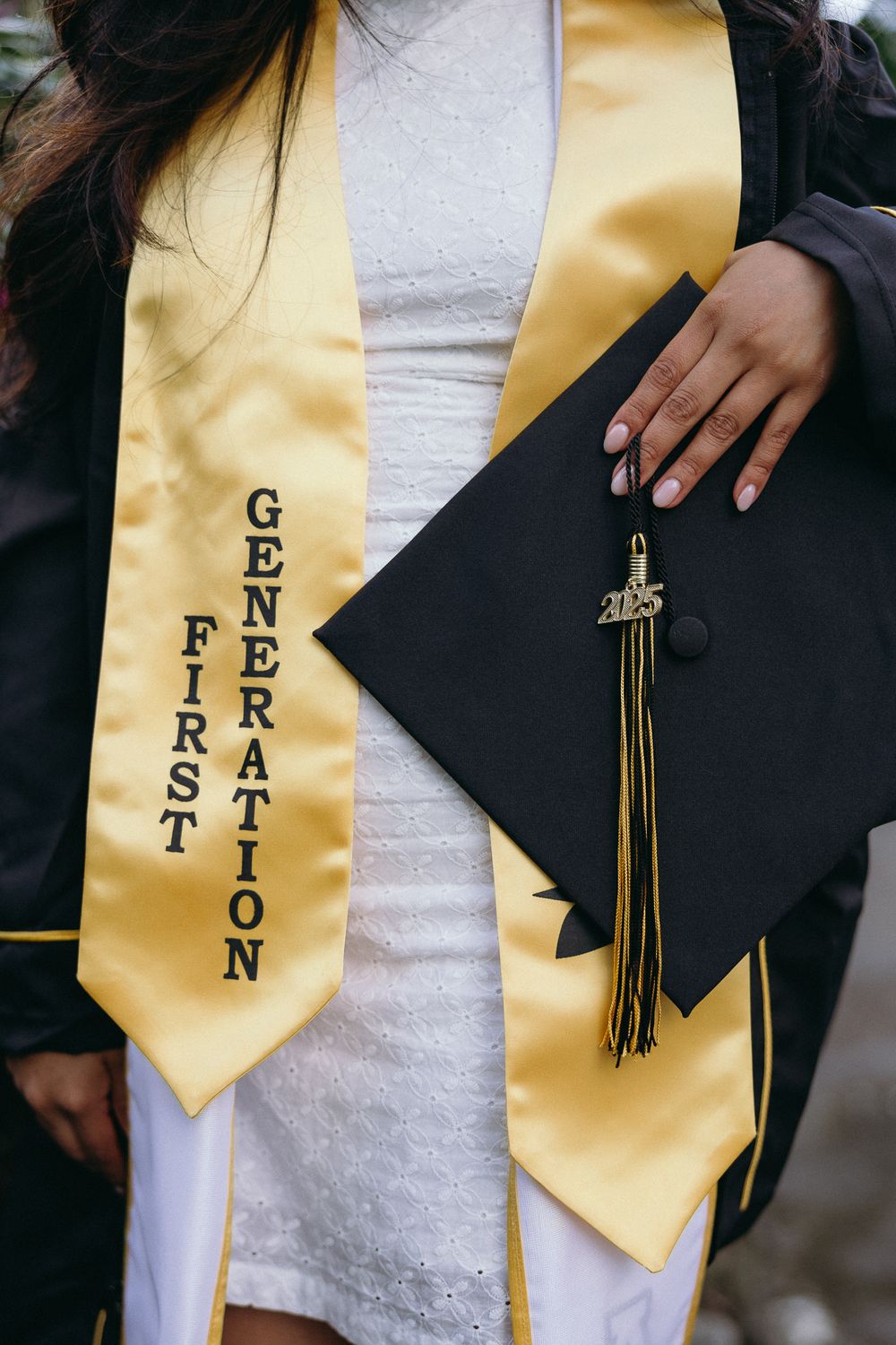 Graduation stole and cap showing First Generation text in gold and black. Separk Mansion Wedding Photographer