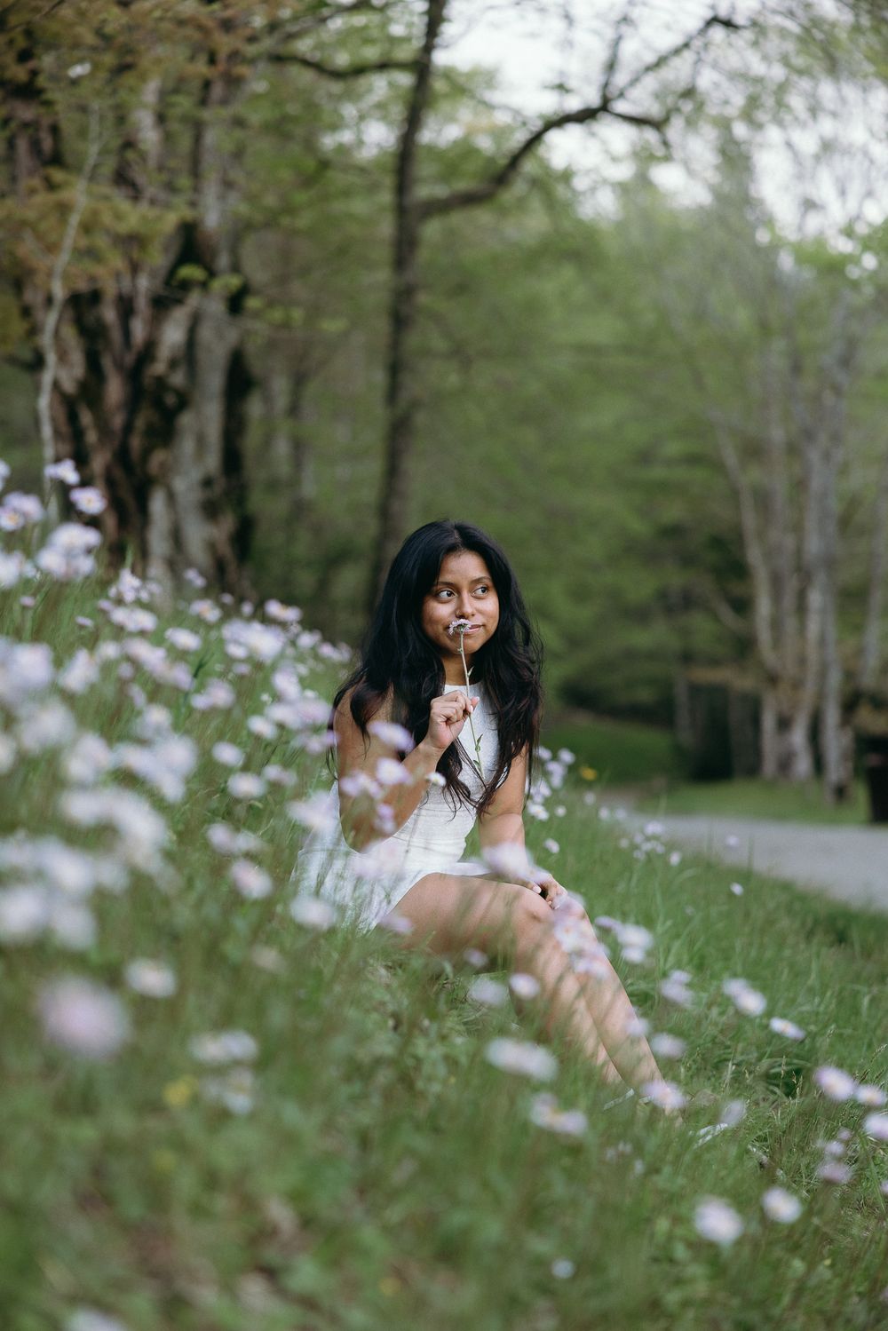 A dreamy portrait among delicate purple wildflowers in a spring meadow. The Bradford Wedding Photographer