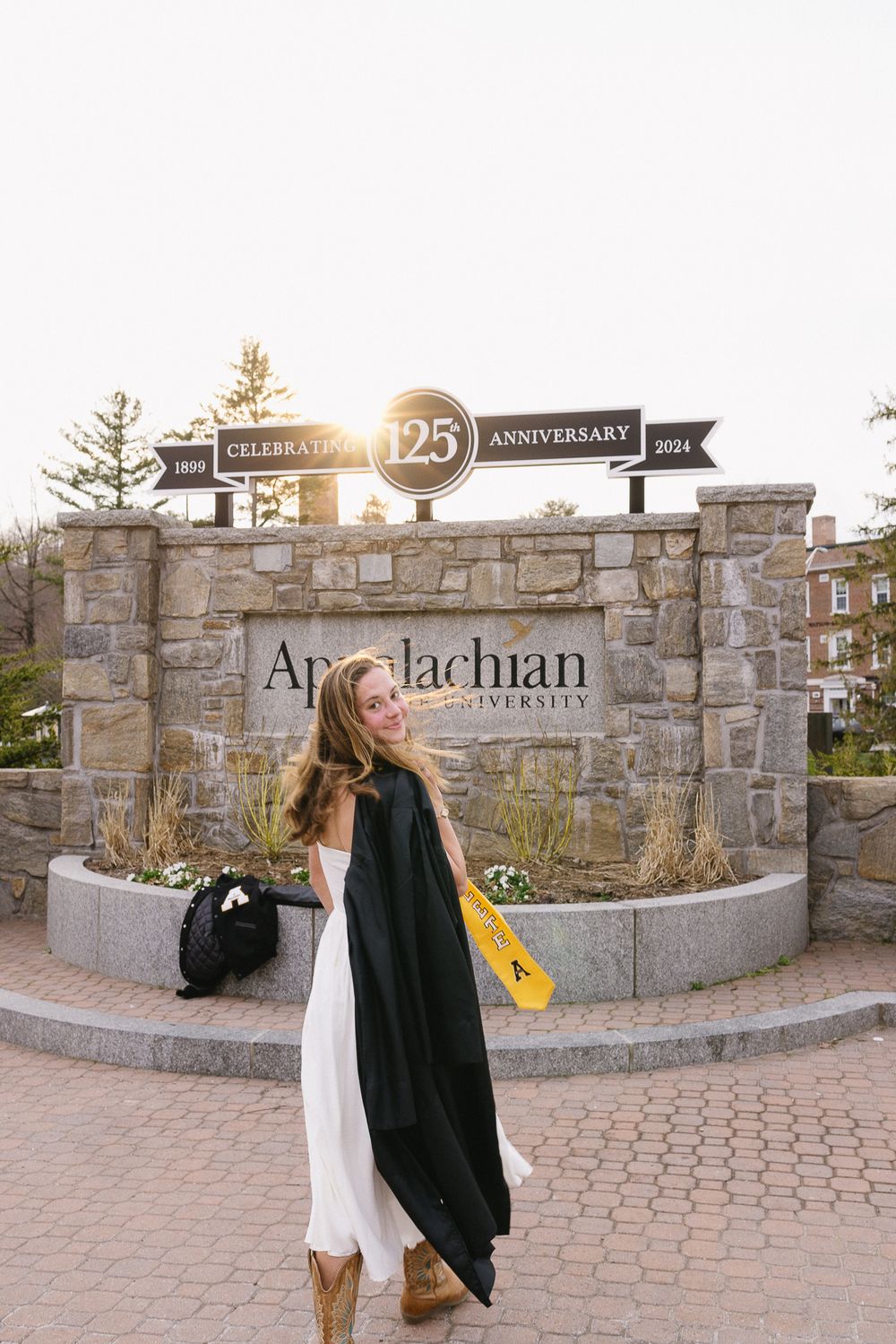 Stone entrance sign for Appalachian's 25th anniversary with decorative archway. The Bradford Wedding Photographer