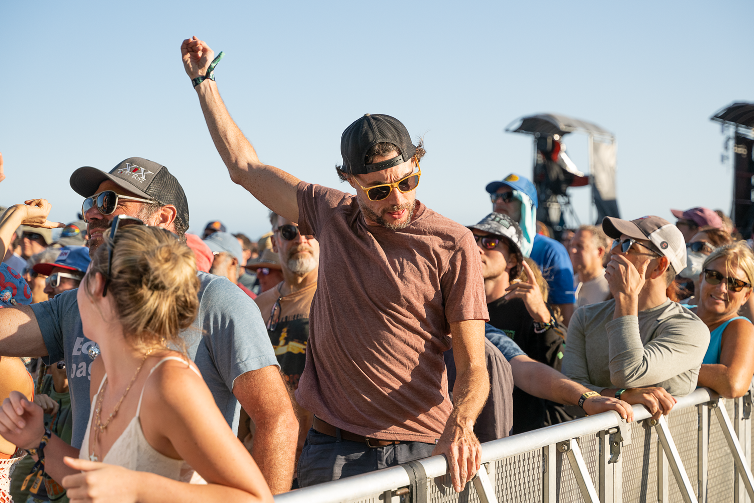 A sea of enthusiastic festival attendees gathered together, immersed in the energy of live music and celebration.