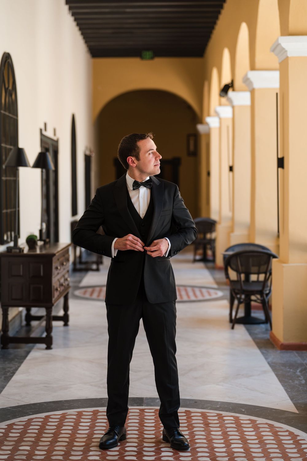 Groom portrait in elegant corridor at Hotel El Convento wedding