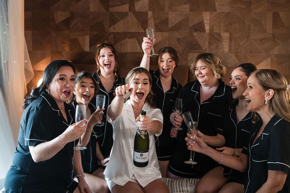 Bridal party celebrating with champagne during getting ready at Hotel El Convento