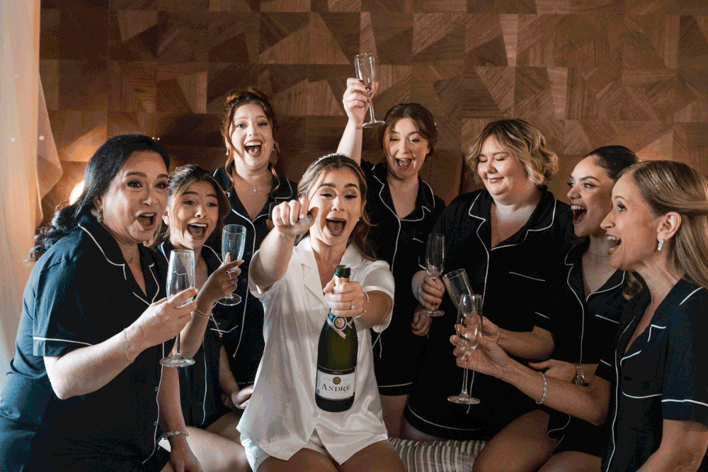 Bridal party celebrating with champagne during getting ready at Hotel El Convento