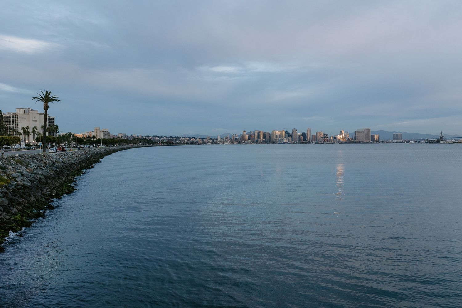A panoramic series of waterfront views showing the San Diego skyline under cloudy skies at Tom Ham's Lighthouse.