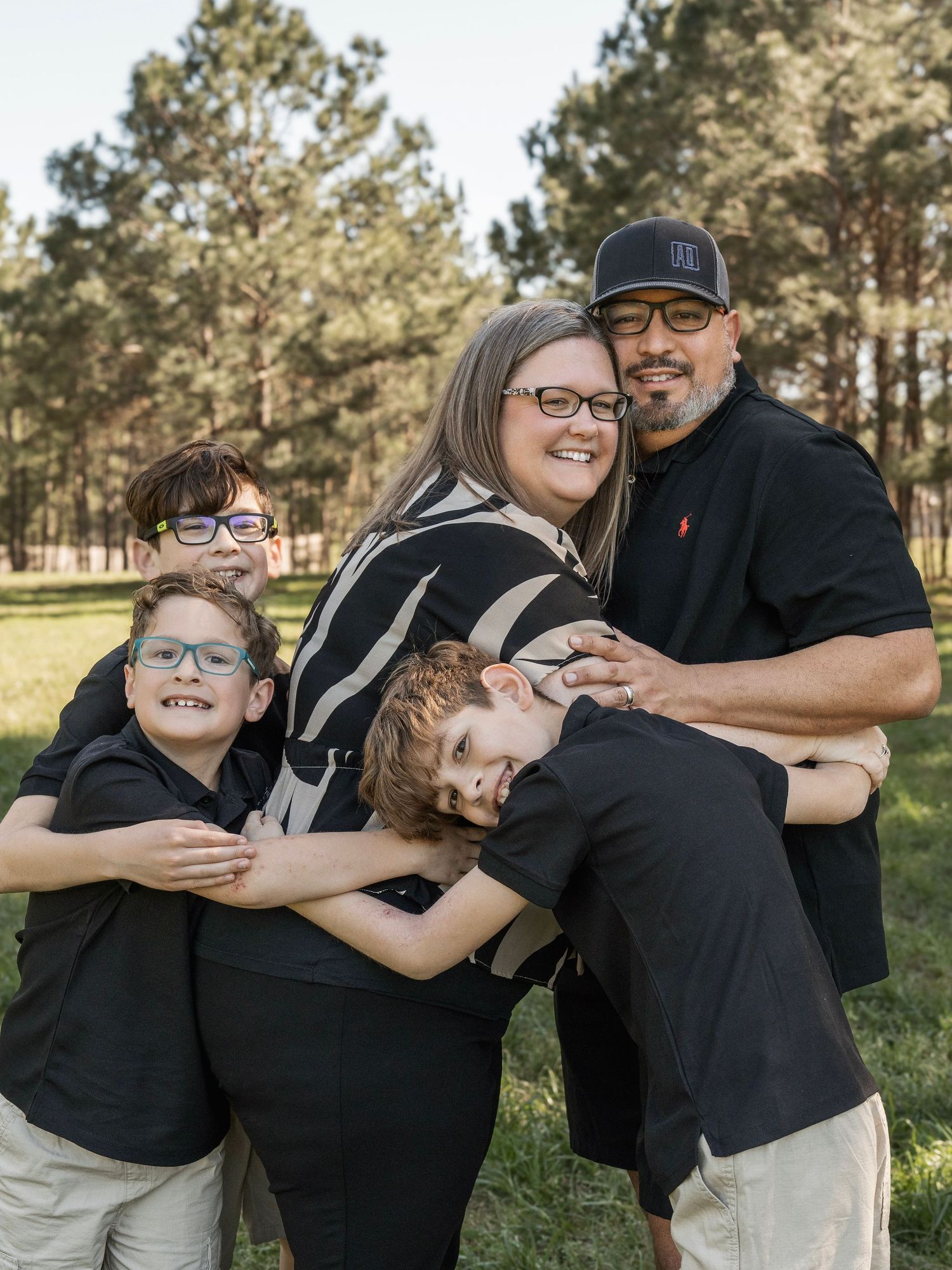 A heartwarming sequence of candid family moments captured outdoors among pine trees on a sunny afternoon.